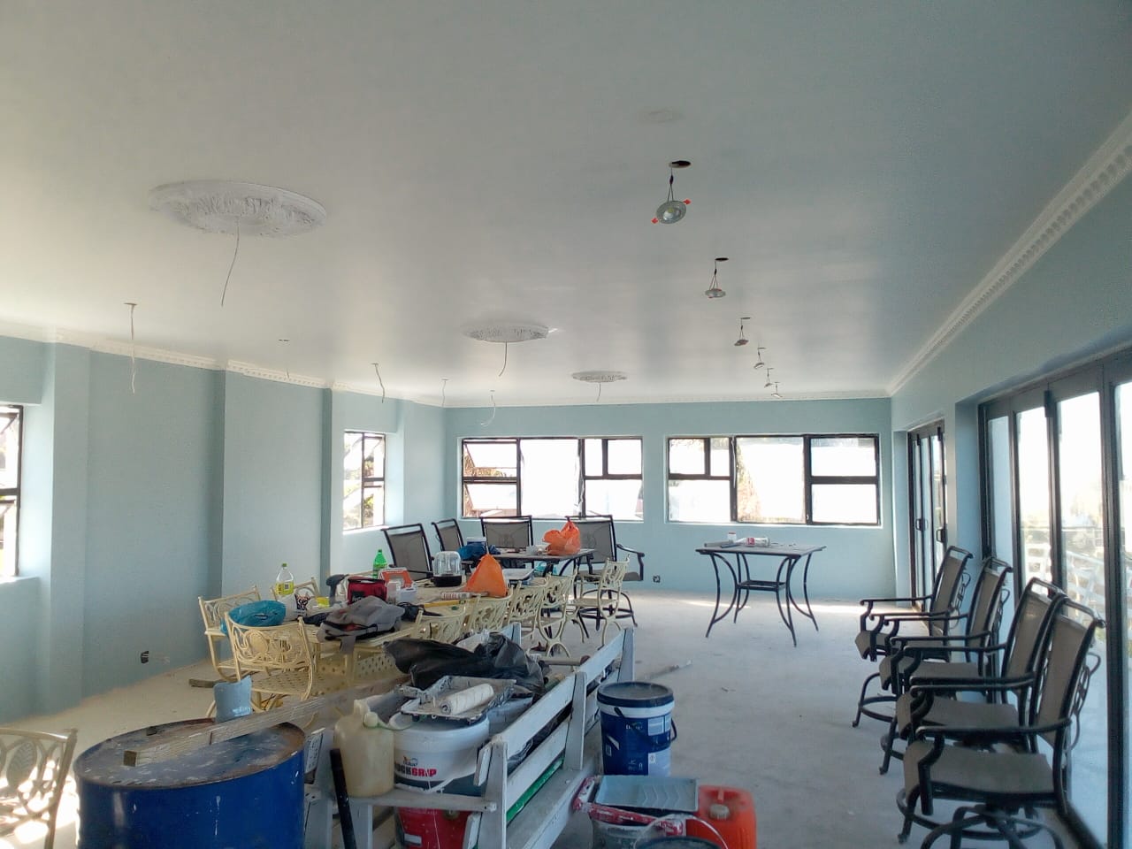 After: Ceiling roses and cornice painted brilliant white — interior renovation completed in Port Elizabeth