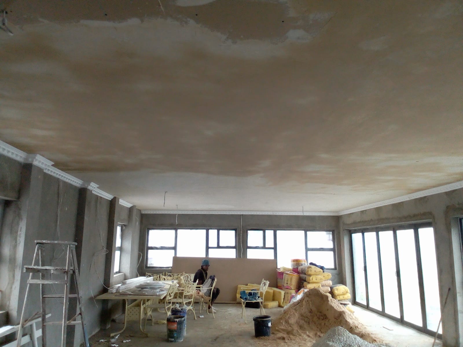 Before: Home renovation Port Elizabeth — raw grey plaster walls and bare ceiling before skimming