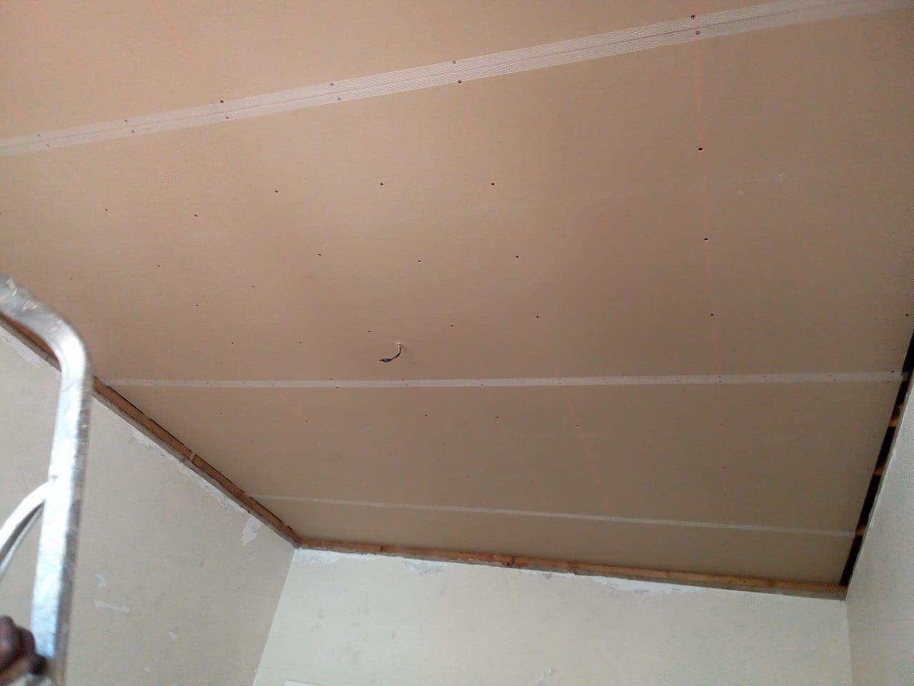 PVC ceiling installation Port Elizabeth — white cornice fitted, teal-blue painted walls, near complete
