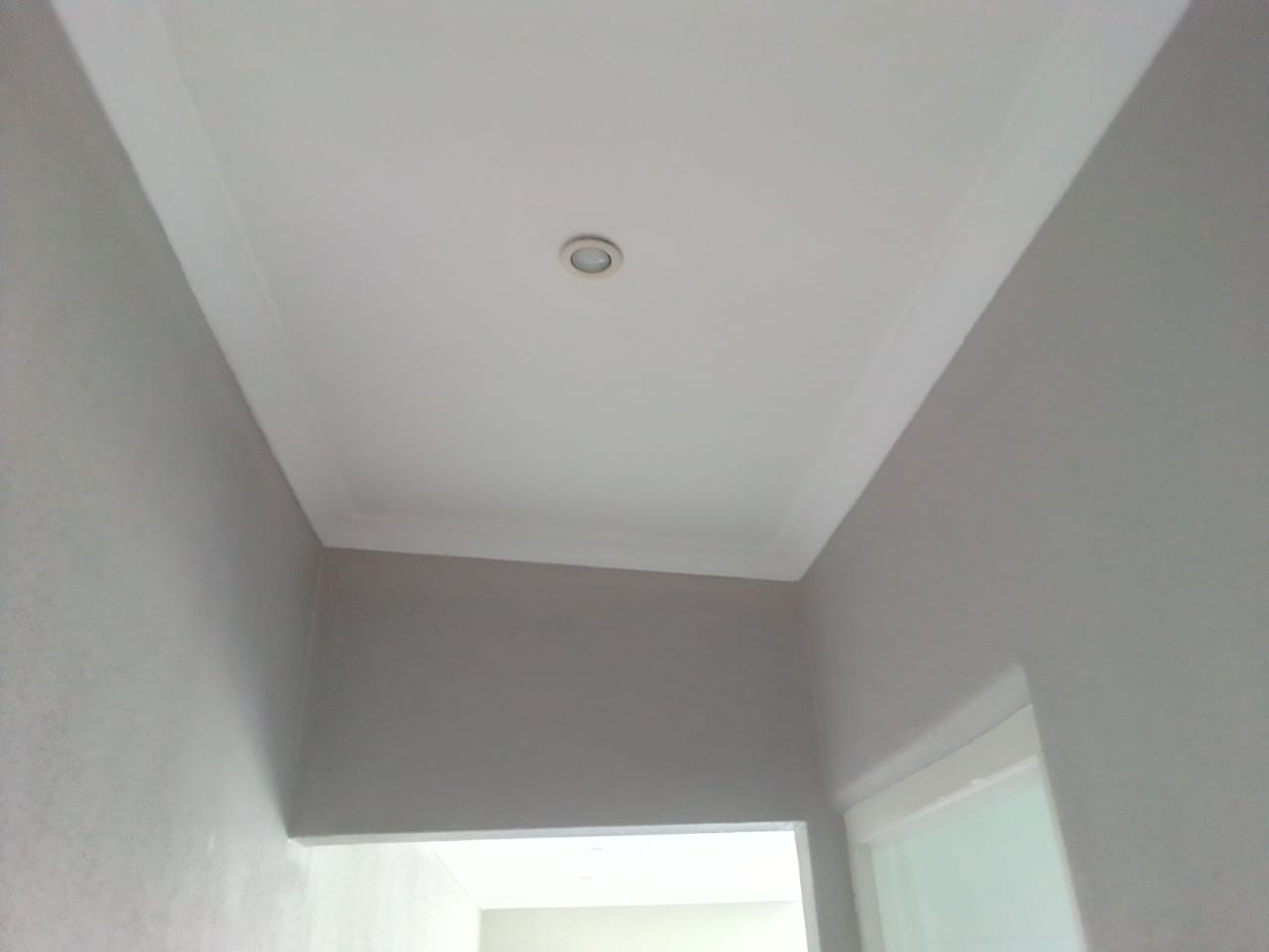 Suspended ceiling installers Port Elizabeth — white rhino board ceiling with recessed downlights, taupe walls and sliding door